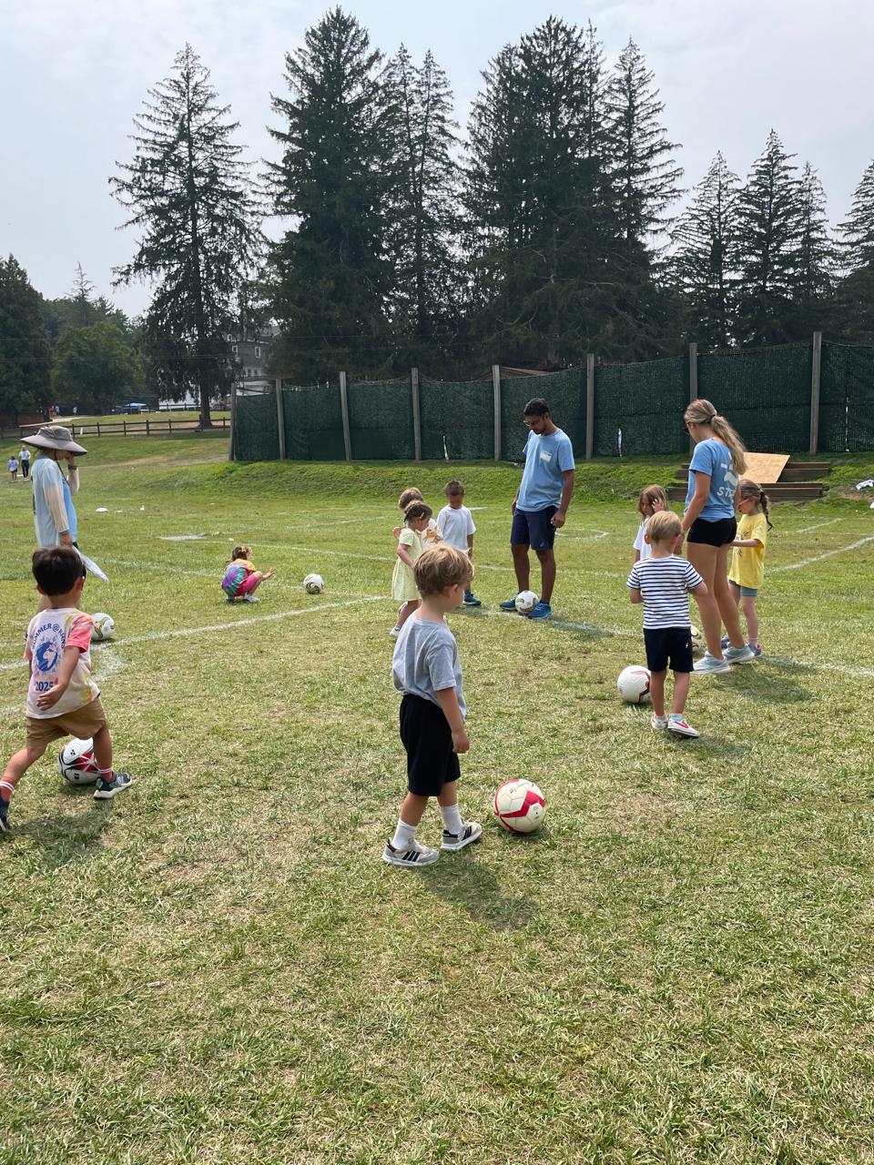 Kids playing football at camp